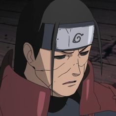 an anime character with black hair wearing a red coat and helmet, staring at the camera