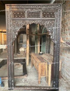 an ornate wooden room divider with benches