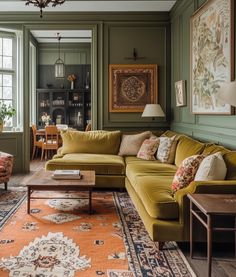 a living room with green walls and furniture