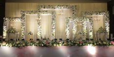 an image of a wedding stage setting with flowers