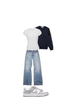 a pair of jeans and a t - shirt are arranged on top of each other