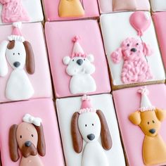 decorated cookies in the shape of dogs and puppies