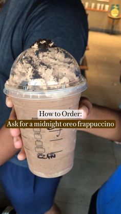 a person holding up a cup with ice cream in it and the words how to order ask for a midnight oreo frappuccino