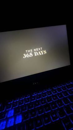 the next 365 days logo is lit up on a laptop computer's backlit keyboard