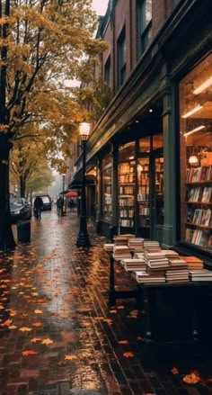 a rainy day in the city with people walking down the street