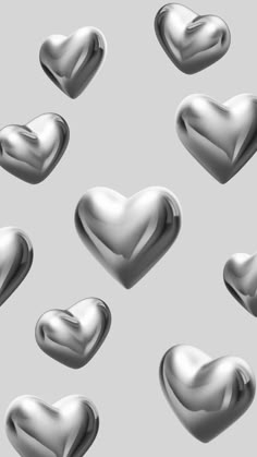 many silver hearts on a gray background