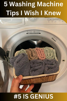 a person is holding towels in front of a washing machine with the words 5 washing machine tips i wish i knew