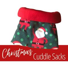 a christmas sweater with santa clause on it and the words christmas cuddle sacks