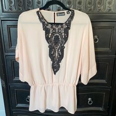 7th Avenue Design Studio New York & Company Peach Black Lace Blouse Size L Dusty Pink With Black Lace In Front Batwing Sleeves Cinched At The Waist Excellent Used Condition Never Worn. No Tags. Like New. Avenue Design, Black Lace Blouse, Batwing Sleeve, Lace Blouse, Dusty Pink, Black Lace, Design Studio, Black Pink, Top Blouse