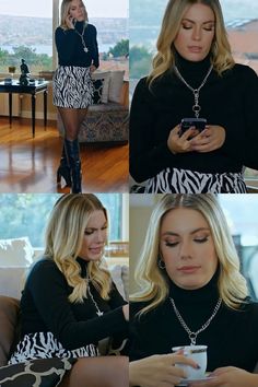 the blonde woman is looking at her cell phone while wearing a black and white dress