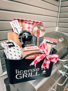 a grilling basket filled with cooking utensils