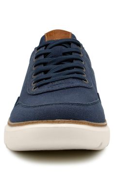 Consciously-made from recycled materials, this casual sneaker features a low-top silhouette. Recycled textile and synthetic upper and lining/recycled textile and synthetic sole Imported Navy Low-top Running Sneakers, Navy Low-top Affordable Sneakers, Navy Low-top Outdoor Sneakers, Medium Width Low-top Synthetic Sneakers, Navy Low-top Textile Sneakers, Michele Watches, Sporty Sunglasses, Nordstrom Women, Man Up