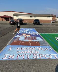 a woman is running on an in - my - spot painted parking lot with the words i know you parked in my spot