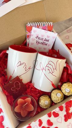 valentine's day gift box with two coffee mugs and candy