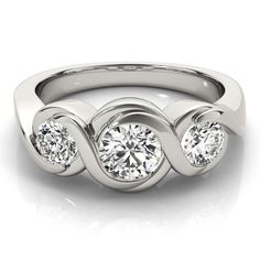 a white gold ring with three round diamonds on the sides and an intertwined band