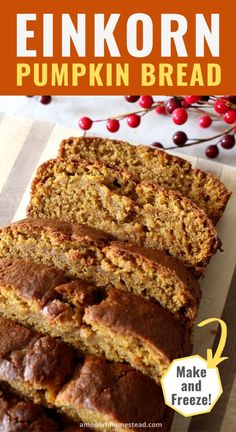 a loaf of pumpkin bread sitting on top of a cutting board next to some cranberries