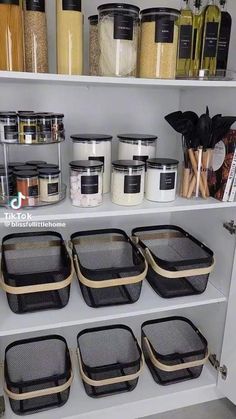 an organized pantry with lots of containers and bins on the shelves, including food