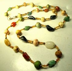 "Porcelain & Gemstone Bead Necklace with Glass Spacer Beads, Multicolors Agate, Jasper, Carnelian Nuggets Necklace length is 33\" ( 83.82cm ) These stone beads are a little crude, Nuggets and almost round with a lovely earthy color design combo...great colors, please scroll to the closeup photo. ------------------ PLEASE NOTE I ONLY ship to your paid ETSY invoice address Please Email any questions..I answer 7 days a week, except when I am sleeping!! VINTAGESTARRBEADS www.vintagestarrbeads.et Multicolor Agate Large Beaded Necklaces, Multicolor Agate Beaded Necklace With Large Beads, Multicolor Large Beads Agate Necklace, Multicolor Agate Beaded Necklaces With Oval Beads, Multicolor Hand-strung Beads Gems And Cabochons For Gift, Spiritual Multicolor Polished Beads Gems And Cabochons, Multicolor Hand-strung Agate Beaded Necklaces, Multicolor Hand-strung Beads, Gems, And Cabochons For Gifts, Hand-strung Multicolor Beads Gems And Cabochons For Gifts