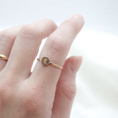 initial is set on a Hammered Band Circle: 6.4mmBand Width: 1.3mm Processing Time: 1-2 Weeks Handmade by Amanda Michelle Stacker Rings, Hammered Band, Initial Ring, Ring Sizer, Cute Rings, Earring Necklace, 3 Weeks, Someone Special, Bridal Jewelry