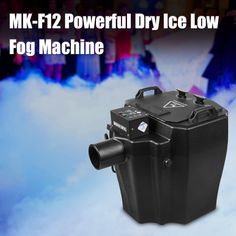 the fog machine is on display in front of a group of people with snow behind it