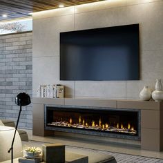 a modern living room with a fireplace and flat screen tv on the wall above it