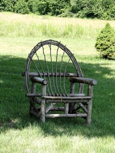 an old chair sitting in the grass