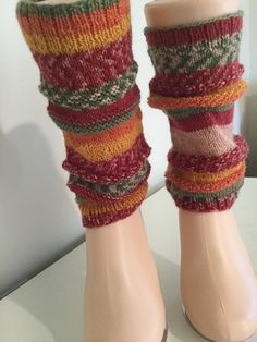 "These leg warmers will be the perfect addition to your holiday closet.  The metallic thread gives them a celebratory vibe.  Knit in the round using the knit stitch and a corresponding pearl stitch they measure 9\" long and stretch from 8-12\"  in circumference  at the top and bottom.   Wear them to dance class or with your favorite pair of winter boots.  You won't be disappointed. 72% superwash wool, 24% nylon  4% metallic thread Machine wash and lay flat to dry." Pearl Stitch, Pedicure Socks, Flip Flop Socks, Best Stocking Stuffers, Leg Warmer, Knit In The Round, Patterned Socks, Knit Stitch, Dance Class