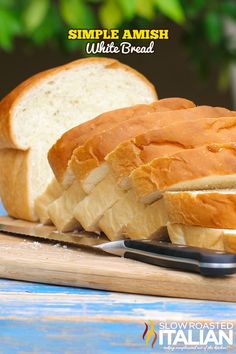 a loaf of bread sitting on top of a cutting board