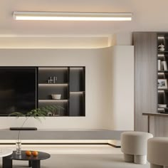 a modern living room with white walls and grey carpeted flooring, built in bookshelves