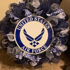 an air force wreath with the words united states air force in blue and white on it