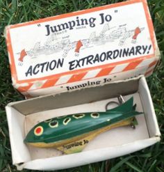 an action extraordinary toy in a box on the grass with it's lid open