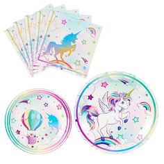 unicorn paper plates and napkins on a white background with rainbow stars in the sky