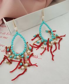 Large Chandelier Earrings made of; - Turquoise Paste stones (4 mm), light blue color; - Freshwater Pearls (4 mm), white color; - Red Coral branches; - Brass chains; - Gold plated 925 Sterling Silver hooks. Lenght : 10 cm / 3,94 inches * SHIPPING * Your order will be shipped within 1-3 business days from your purchase. You can choose between 2 shipping methods: STANDARD MAIL (NOT TRACEABLE) It is a cheap and fast shipping method, but NOT TRACEABLE. Chapeau Atelier is not responsible for any posta Cheap Large Beaded Turquoise Earrings, Large Chandelier, Ocean Jewelry, Large Chandeliers, Coral Earrings, Baroque Fashion, Light Blue Color, Brass Chain, Earrings Photo