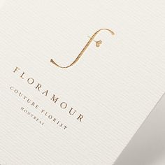 the logo for floramour, a boutique hotel in mont - saint - michel