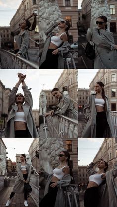 the woman is posing in front of some buildings