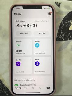 a cell phone with money on the screen