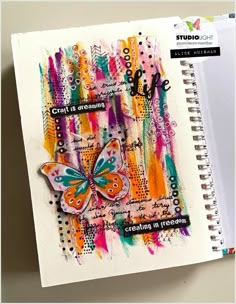 an art journal with a butterfly on it