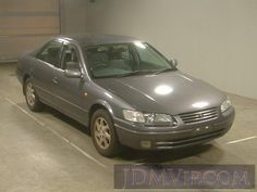 a grey car parked in a parking space