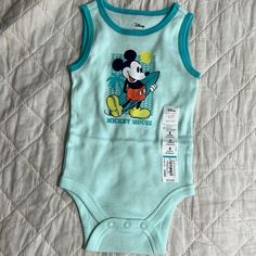 Jumping Beans Baby Beans Disney Mickey Mouse 6 Months Bodysuit New With Tags Blue Onesie With Character Print For Playtime, Playtime Blue Onesie With Character Print, Blue Character Print Onesie For Playtime, Playful Blue Onesie With Cartoon Print, Blue Cotton Onesie With Character Print, Blue Sleeveless Cotton Bodysuit, Blue Sleeveless Onesie For Playtime, Blue Sleeveless Onesie For Play, Playful Blue Sleeveless Onesie