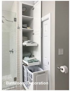 a white bathroom with an open shower door