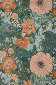 an orange and green floral pattern on fabric