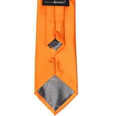 This orange clip-on tie features a pre-tied knot for easy use. It is made from a heavyweight woven material with slight ribbing. Though sized for men, the 3.5-inch width is equally versatile for women and teens, too. Popular for individual use, but priced right for restaurant, staff or other large group attire.We recommend this shade for a basic bright orange. See it in person by requesting a free color swatch. Product Features Traditional 3.5" width, at the widest point Standard men's 20" lengt Restaurant Staff, Tied Knot, Color Swatch, Bright Orange, Free Coloring, Tie Clip, The 3, Product Features, Knot