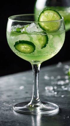 two glasses filled with cucumber and lime drink