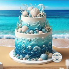 there is a blue and white cake on the beach with seashells around it