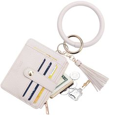 a white leather wallet keychain with keys in it