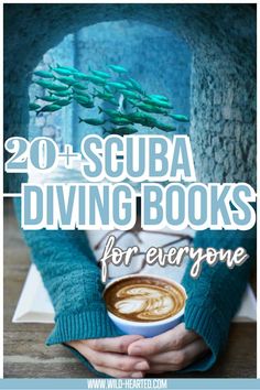 someone holding a cup of coffee in their hands with the words 20 scuba diving books for everyone