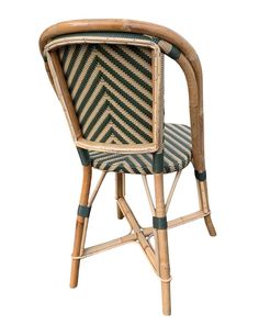 a chair made out of bamboo and wicker with an upholstered backrest