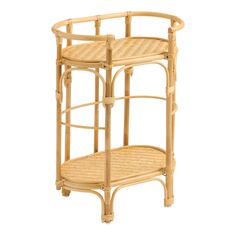 a bamboo and wicker side table with two shelves on each side, one shelf holding a basket