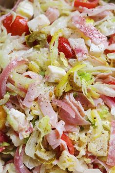 a bowl filled with pasta and ham on top of a table