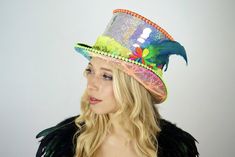 Want something that no one else has? Looking for EXACTLY what you want? You’ve come to the right place for bespoke top hats! We specialize in making truly unique festival hats and sequined headdresses for special occasions. :) FEATURES: All hats come with LED Lights Each sequin is glued by hand with industrial grade adhesives. Our hats are often imitated but the durability is NEVER duplicated. This hat is built to last and party as hard as you do! HOW IT WORKS:Anything is possible - Let us know Holographic Jacket, Light Up Hats, Rave Hats, Festival Hats, Rave Mask, Steampunk Hat, Custom Top, Rave Bra, Festival Hat